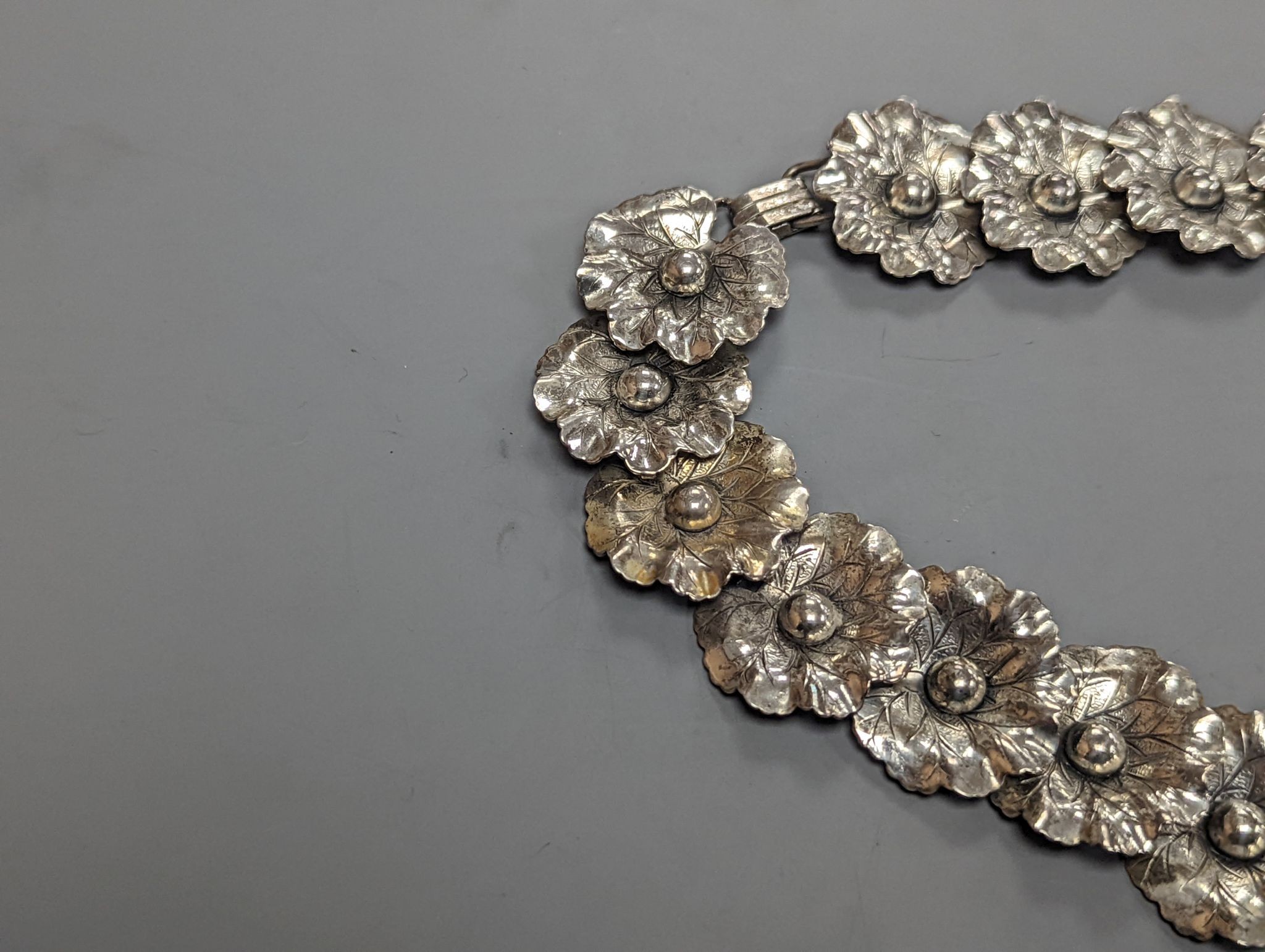 A Danecraft sterling flower head link necklace, 42cm and a Danish sterling fish link bracelet.
